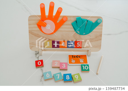 Math board showing a completed addition equation. Helps children understand results and reinforces basic arithmetic skills. Math board showing a completed addition equation. Helps children understand results and reinforces basic arithmetic skills. 139487734