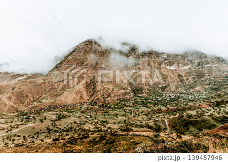 Landscape of Dagestan mountains, mountain range in haze summer Russia Landscape of Dagestan mountains, mountain range in haze summer Russia 139487946