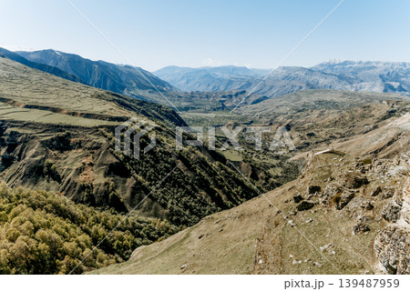 Landscape of Dagestan mountains, mountain range in haze summer Russia Landscape of Dagestan mountains, mountain range in haze summer Russia 139487959