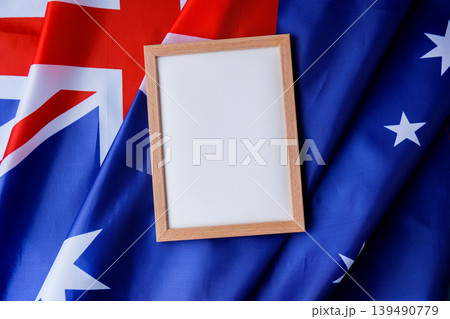 White empty paper copy space template mock up Australian flag background. National symbol and patriotism concept, ideal mock-up for custom copy designs. Place your logo or text on the white paper 139490779
