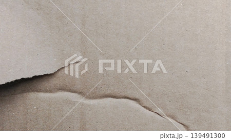 Close up of torn brown recycled paper texture background 139491300