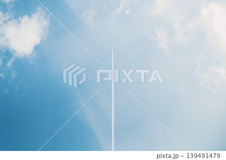 Plane flying on blue cloudy sky, air transport, sunny day, fluffy clouds Plane flying on blue cloudy sky, air transport, sunny day, fluffy clouds 139491479