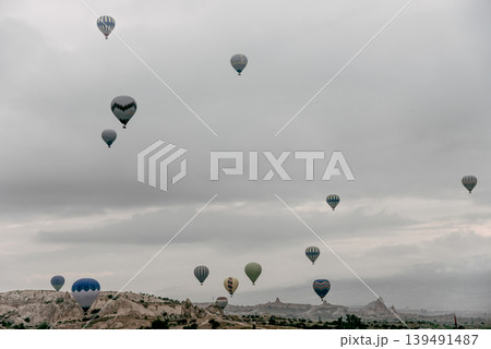 Air balloon flight early morning dawn cloudy sky mountain rock Cappadocia Turkey Air balloon flight early morning dawn cloudy sky mountain rock Cappadocia Turkey 139491487
