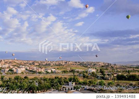 Air balloon flight early morning dawn cloudy sky mountain rock Cappadocia Turkey 139491488