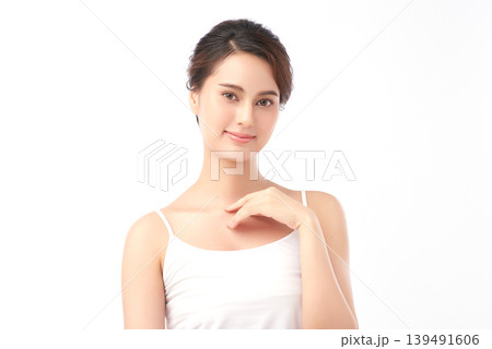 A beautiful young Asian woman with clean, fresh skin against a white background. Skincare, facial treatment, cosmetology, beauty, and spa. An elegant portrait of an Asian woman. A beautiful young Asian woman with clean, fresh skin against a white background. Skincare, facial treatment, cosmetology, beauty, and spa. An elegant portrait of an Asian woman. 139491606