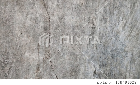Gray Concrete Wall Texture with Natural Cracks Background Gray Concrete Wall Texture with Natural Cracks Background 139491628