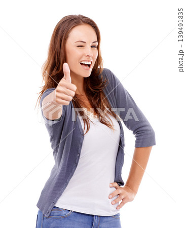 Thumbs up, portrait and woman wink in studio for winning achievement, celebrate deal and vote on white background. Happy model, emoji sign and yes for feedback, promotion and thank you for excellence Thumbs up, portrait and woman wink in studio for winning achievement, celebrate deal and vote on white background. Happy model, emoji sign and yes for feedback, promotion and thank you for excellence 139491835