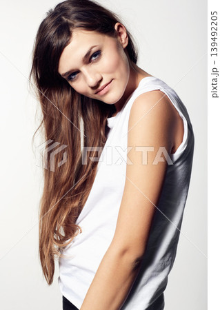 Portrait, skincare and hair with a natural woman in studio on a white background for cosmetic wellness. Beauty, haircare and a confident young person at the salon for shampoo or keratin treatment Portrait, skincare and hair with a natural woman in studio on a white background for cosmetic wellness. Beauty, haircare and a confident young person at the salon for shampoo or keratin treatment 139492205