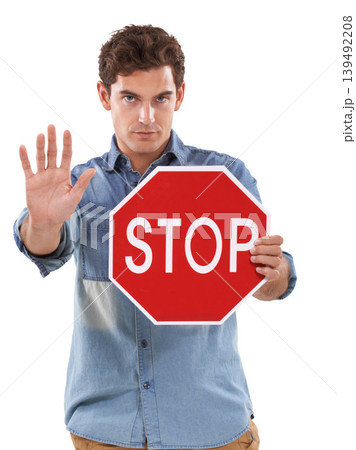 Portrait, man and traffic stop sign, palm and studio isolated on a white background. Person show red octagon symbol, hand and danger warning, forbidden caution and serious, security or prohibition Portrait, man and traffic stop sign, palm and studio isolated on a white background. Person show red octagon symbol, hand and danger warning, forbidden caution and serious, security or prohibition 139492208