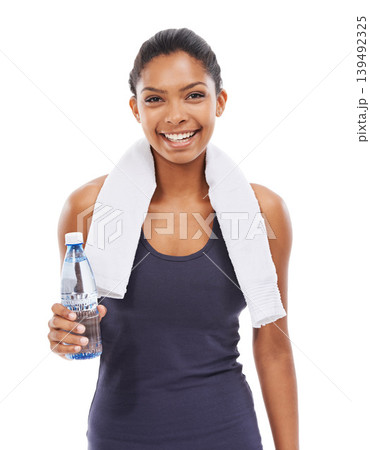 Happy woman, portrait smile and water bottle with towel for workout against a white studio background. Face of female person with natural mineral drink for hydration in exercise, fitness or wellness 139492325