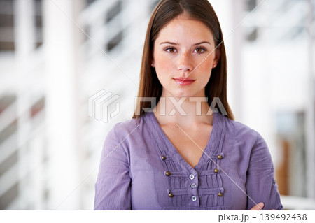 Portrait, confident and a business woman arms crossed in her professional office for an internship. Mindset, serious and attitude with a young employee in her design agency workplace or company Portrait, confident and a business woman arms crossed in her professional office for an internship. Mindset, serious and attitude with a young employee in her design agency workplace or company 139492438