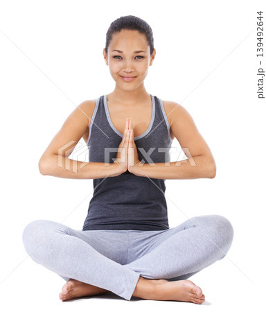 Woman, yoga and praying hands in studio fitness, meditation and holistic workout or mental health wellness. Portrait of a young person with calm, peace and zen exercise or faith on a white background Woman, yoga and praying hands in studio fitness, meditation and holistic workout or mental health wellness. Portrait of a young person with calm, peace and zen exercise or faith on a white background 139492644
