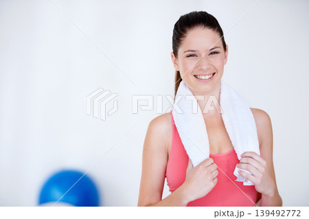 Smile, gym mockup or portrait of happy woman with towel for fitness or wellness with confidence. Proud, female athlete or healthy sports person ready to start workout, training or exercise with space 139492772