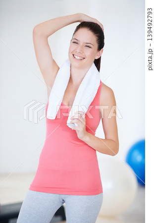 Laughing, gym or portrait of happy athlete with towel for fitness or wellness with confidence. Smile, funny model or healthy sports woman ready to start workout, training or exercise with energy 139492793