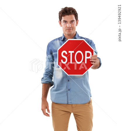 Portrait, man and traffic stop sign in studio isolated on a white background mockup space. Person show red octagon symbol, forbidden warning signal and caution, attention and security in protection 139492921