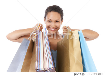 Happy woman, portrait and shopping bag for discount, sale and retail giveaway in commerce on a white background. Fashion winner, customer or excited african person with gift or winning deal in studio Happy woman, portrait and shopping bag for discount, sale and retail giveaway in commerce on a white background. Fashion winner, customer or excited african person with gift or winning deal in studio 139493008