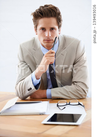 Business man, thinking and serious in portrait, professional and planning on tablet or paperwork. Male person, confidence and contemplating strategy for company future in office, face and technology Business man, thinking and serious in portrait, professional and planning on tablet or paperwork. Male person, confidence and contemplating strategy for company future in office, face and technology 139493016