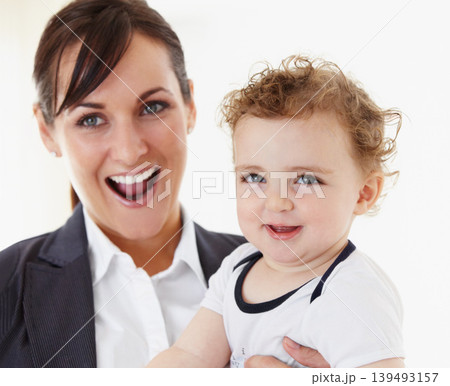 Happy, baby and mom in portrait with business, work and motherhood with a professional career. Mockup, space and woman in a suit smile with love, care and playing with child in home or morning Happy, baby and mom in portrait with business, work and motherhood with a professional career. Mockup, space and woman in a suit smile with love, care and playing with child in home or morning 139493157