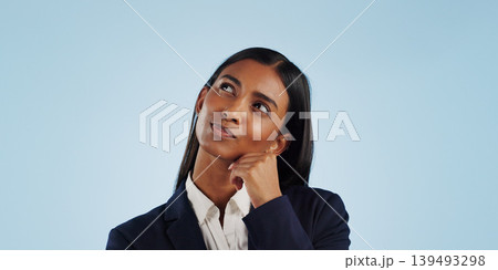 Thinking, studio or businesswoman on blue background for problem solving, vision or solution. Idea, doubt or decision with a female attorney or lawyer contemplating a thought, choice or legal option Thinking, studio or businesswoman on blue background for problem solving, vision or solution. Idea, doubt or decision with a female attorney or lawyer contemplating a thought, choice or legal option 139493298