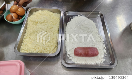 Chef Preparing Breading Station with Meat Flour and Breadcrumbs for Deep Frying 139493364