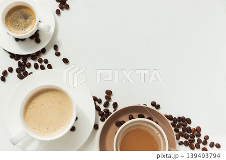 Coffee Cups with Beans in Circular Arrangement on White Background Coffee Cups with Beans in Circular Arrangement on White Background 139493794