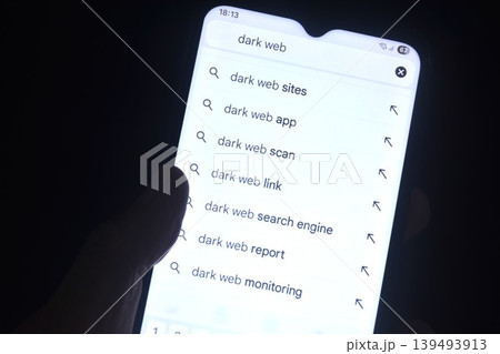 searching of dark website on mobile phone holding in human hand in night searching of dark website on mobile phone holding in human hand in night 139493913