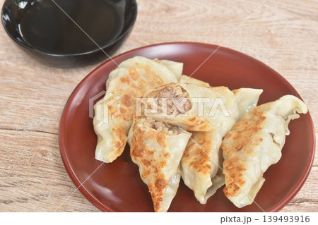 crispy fried Gyoza or Japanese dumpling stuffed mashed beef meat and vegetable dipping shoyu  on plate 139493916