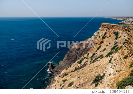 Cape Fiolent in Crimea, view of Black Sea and cliff in summer on sunny day Cape Fiolent in Crimea, view of Black Sea and cliff in summer on sunny day 139494132