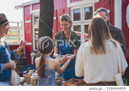 Buying organic produce at local farmers market. Buying organic produce at local farmers market. 139494450