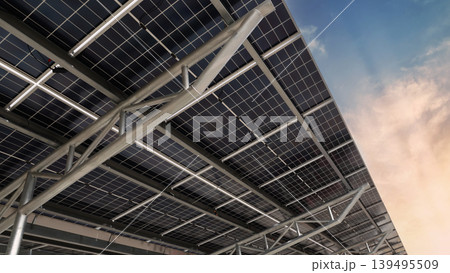 Solar panel car park roof. Low angle shot of Solar panel carport roof with steel structure generating clean renewable energy. Sustainable parking canopy with photovoltaic cells for eco power energy. 139495509