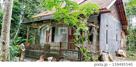Village house surrounded by forest 139495540