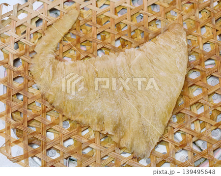 Processed premium shark fin on traditional woven bamboo tray Processed premium shark fin on traditional woven bamboo tray 139495648