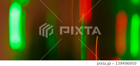 Abstract defocused neon bokeh lights with green and red glow for a vibrant night background Abstract defocused neon bokeh lights with green and red glow for a vibrant night background 139496950