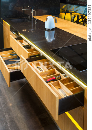 Open drawers, modern kitchen Open drawers, modern kitchen 139497521