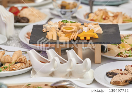 Delightful cheese platter at a festive gathering Delightful cheese platter at a festive gathering 139497732