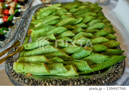 Delicious green pancakes arranged beautifully 139497766