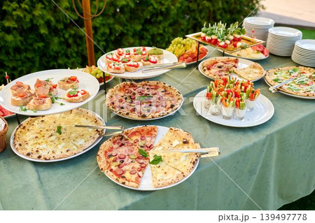 Delightful spread of gourmet dishes at sunset Delightful spread of gourmet dishes at sunset 139497778