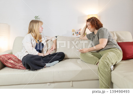 Women having serious conversation about family problems Women having serious conversation about family problems 139498493