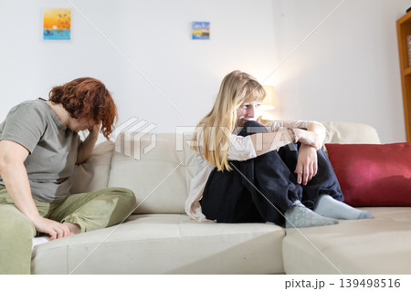 Women experiencing conflict and sadness on a sofa 139498516
