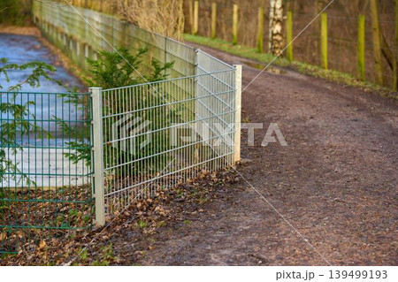Winding metal fence 139499193