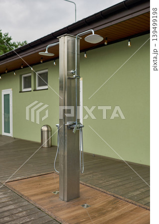 Sunlit outdoor shower Sunlit outdoor shower 139499198