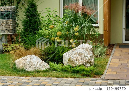 Entrance to the building with gabions and garden stones Entrance to the building with gabions and garden stones 139499770