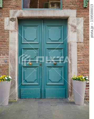 Beautiful teal door with stylish planters Beautiful teal door with stylish planters 139500013