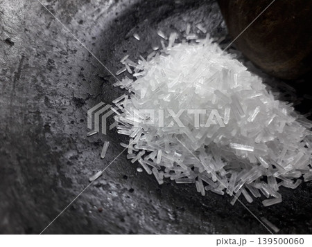 Monosodium Glutamate Crystals on Black Clay Mortar with Copy Space Monosodium Glutamate Crystals on Black Clay Mortar with Copy Space 139500060