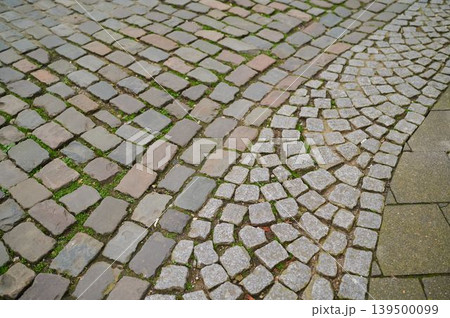 Cobblestone path through city history Cobblestone path through city history 139500099