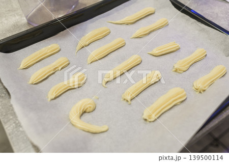 Perfectly piped pastries ready! 139500114