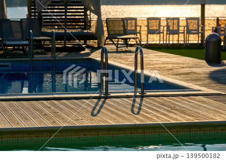 Evening tranquility by the poolside 139500182