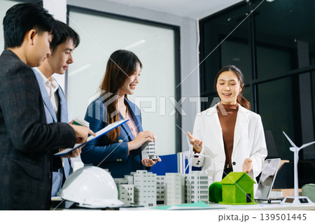 business team people planning and discussing on recycle reduce reuse policy symbol in office meeting room. Green business company and Solar Energy Environment city 139501445