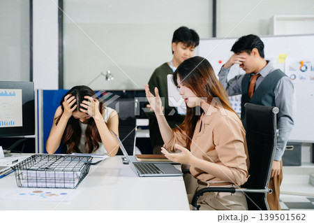 Stressed business team dealing with problem and deadline pressure in office meeting, showing conflict, frustration, and workplace challenges Stressed business team dealing with problem and deadline pressure in office meeting, showing conflict, frustration, and workplace challenges 139501562