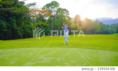 Golfers are putting golf in the evening golf course golf backglound. 139504166